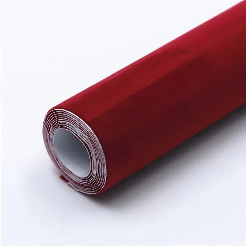 Rolls and sheets of coloured self-adhesive suede leather material for DIY projects.