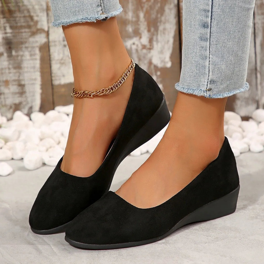 Women's pointed toe wedge pumps in suede with low wedge heel