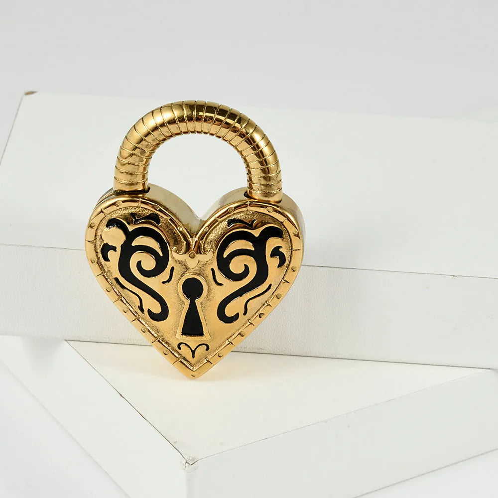 Heart-shaped stainless steel ear piercing stud with electroplated gold finish on white background