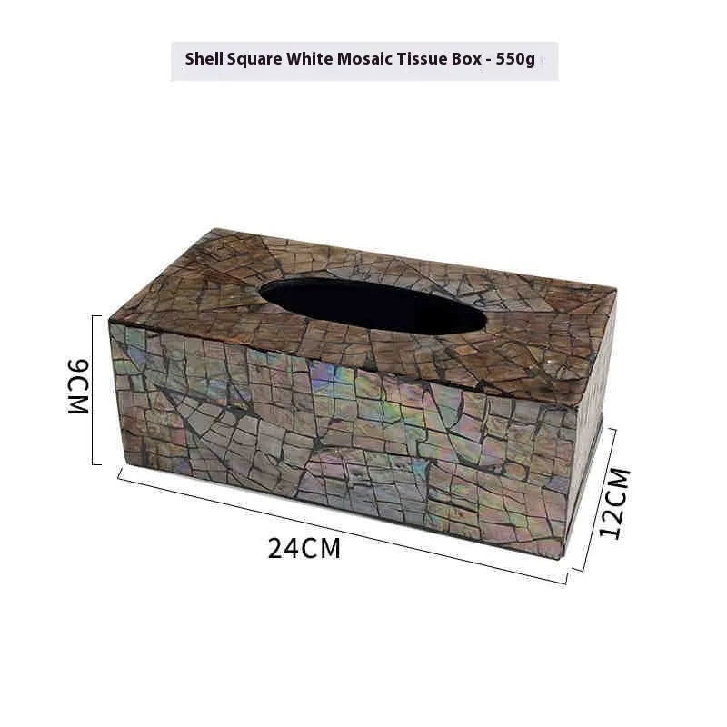 Black natural shell tissue box storage organiser with removable compartment on a coffee table.