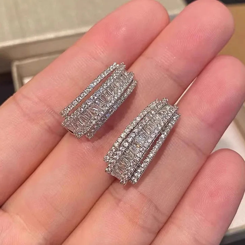 Geometric zircon stud earrings in white gold colour with copper construction