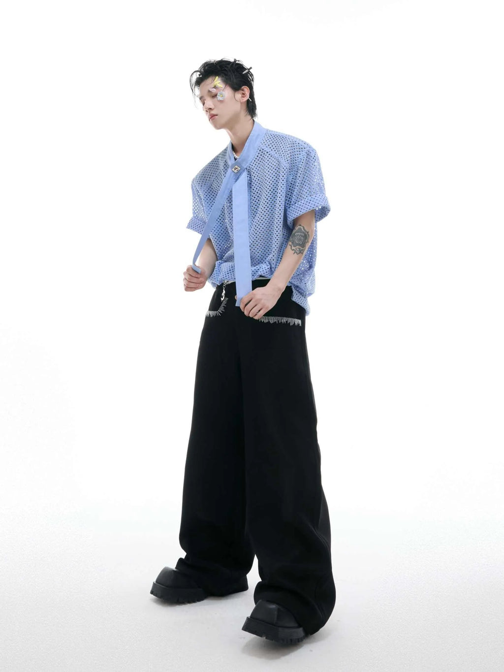Men's black T-shirt with tie stitching and metal tassel decoration on front