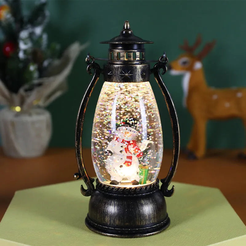 Plastic Christmas oil lamp decoration with LED light showing snowman figurine inside crystal ball dome.
