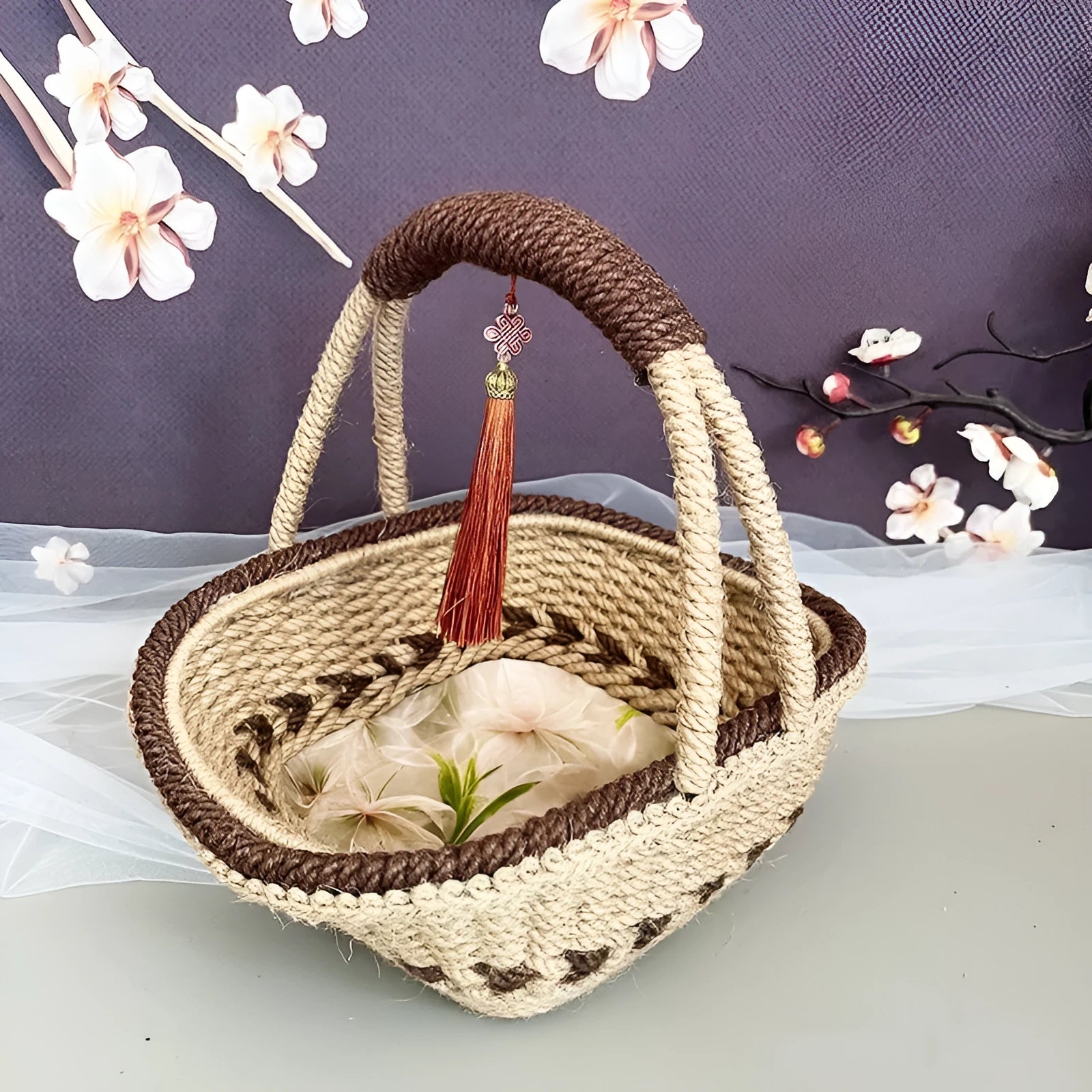 Coffee brown hand-woven hemp rope basket with straw trim, shown from the side.