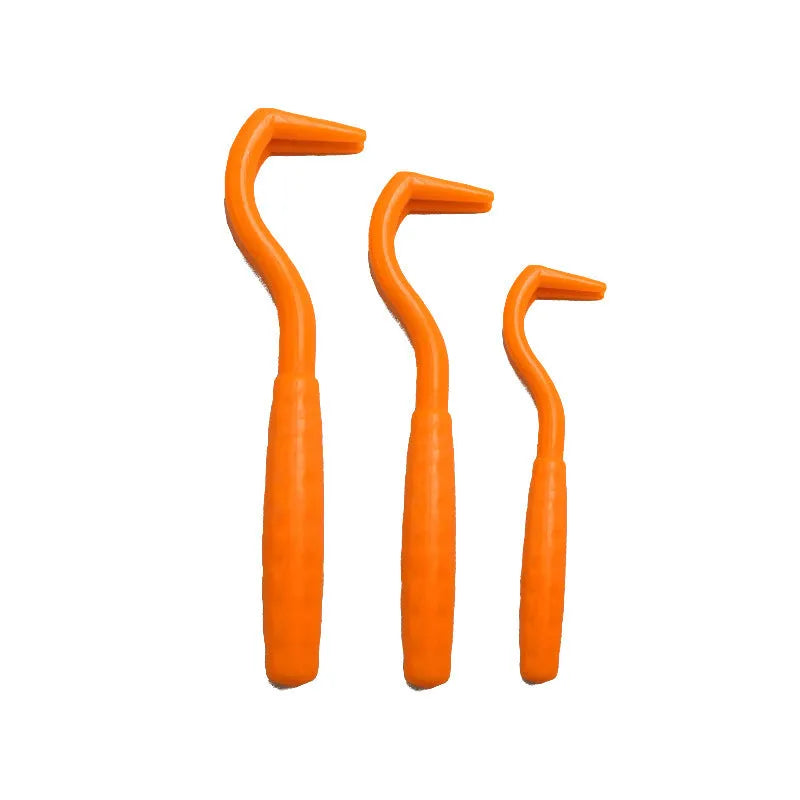 Set of three coloured plastic tick hook removal tools for dogs on a white background.