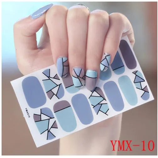 Full nail stickers set of 14 sheets showing 16 colour options in a flat lay arrangement