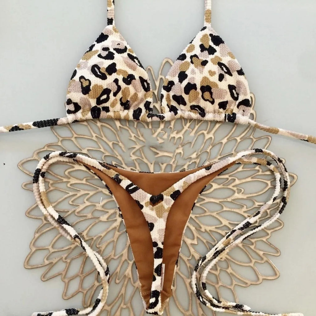 Women's printed bikini swimsuit with briefs style on a neutral background.