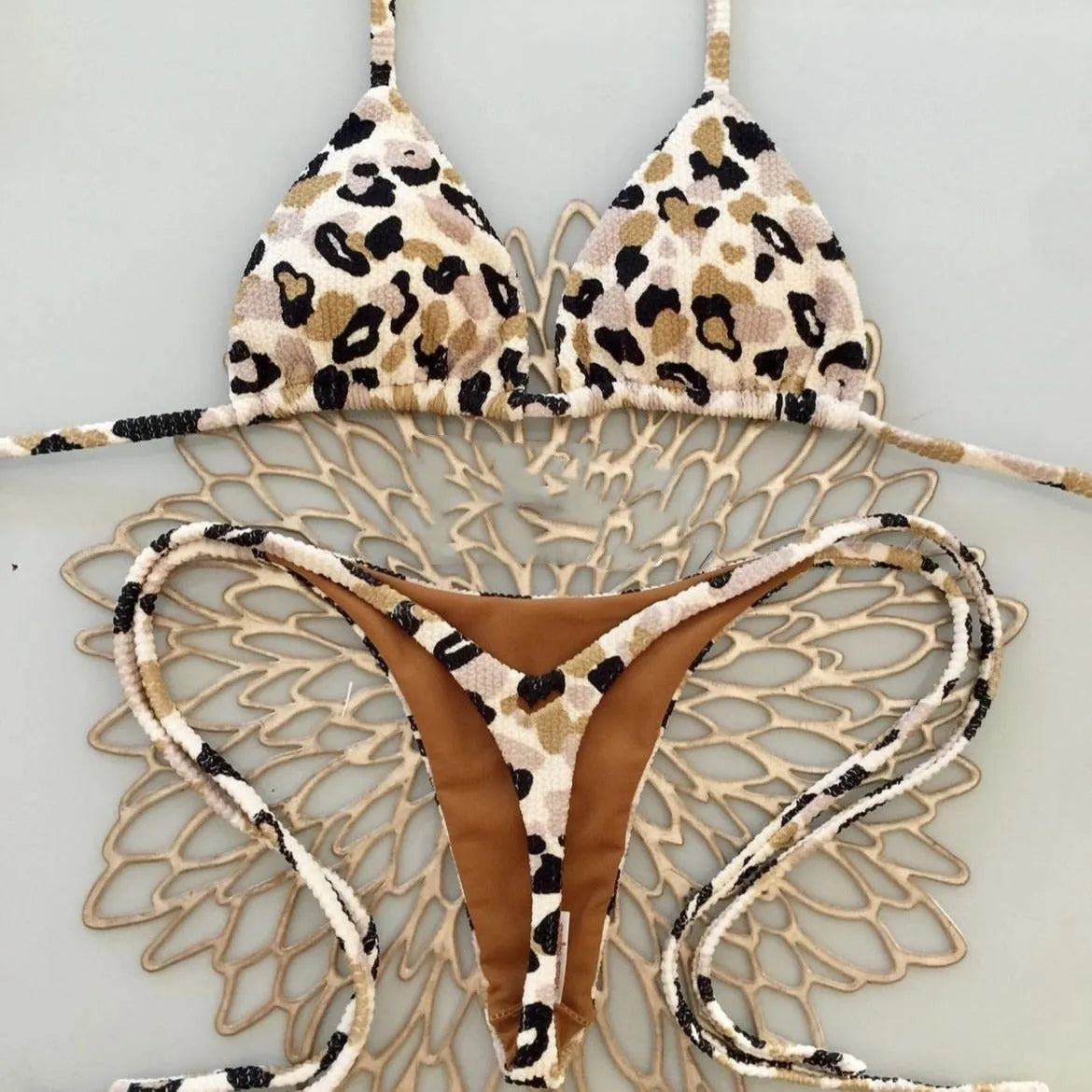 Women's printed bikini swimsuit with briefs style on a neutral background.
