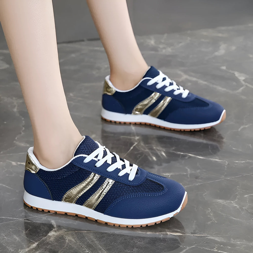 Blue women's sports shoes with cross shoulder straps, round toe, and flat rubber sole.
