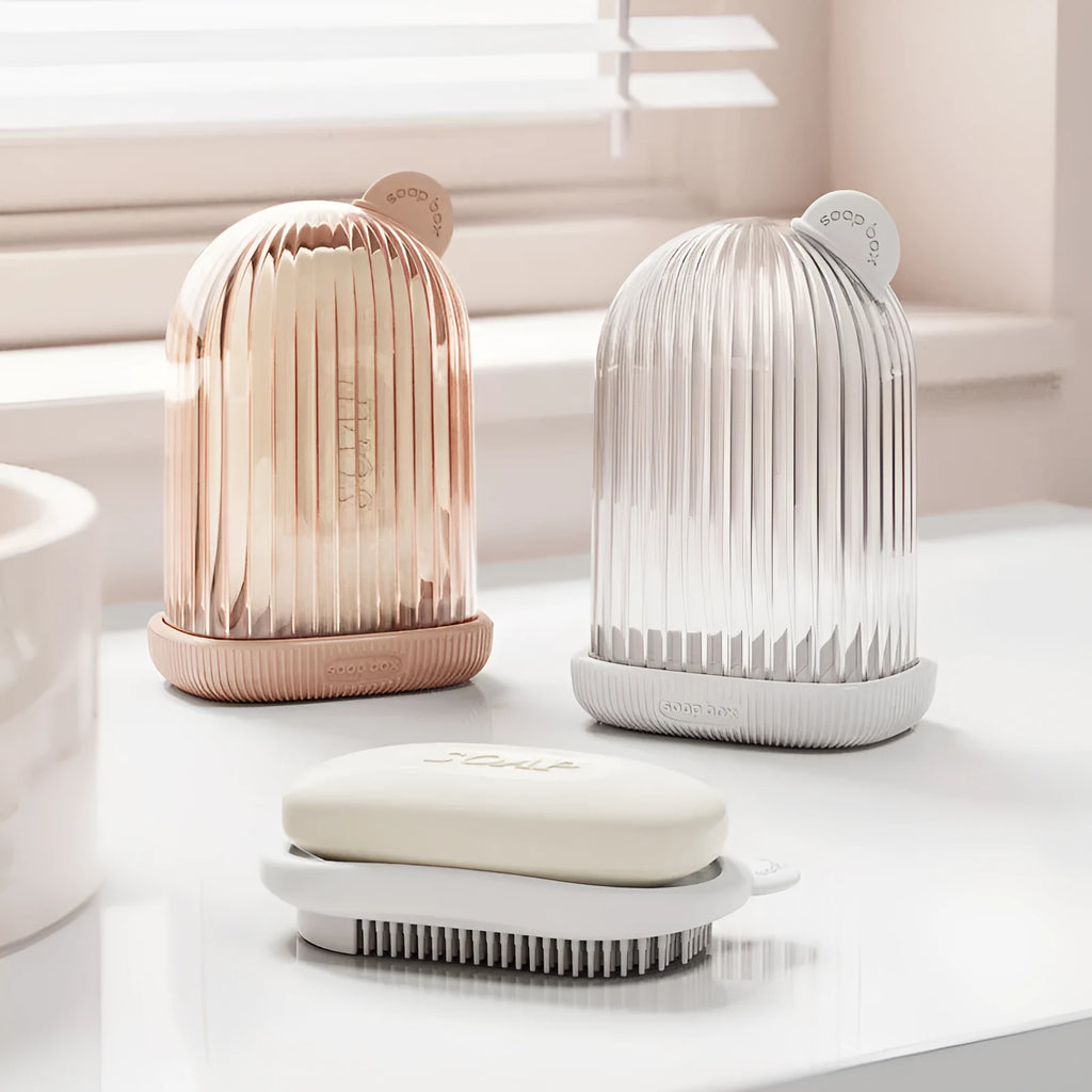 Compact PET travel soap dish in cream white, with a bar of soap on top