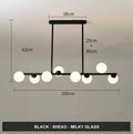 Modern minimalist glass bubble ball chandelier with black iron body and clear glass shades in a Nordic style