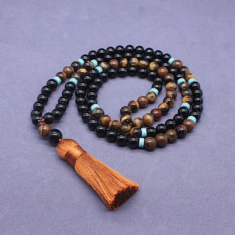 Natural agate jewellery set showing black agate bracelet and Tiger stone necklace with geometric design