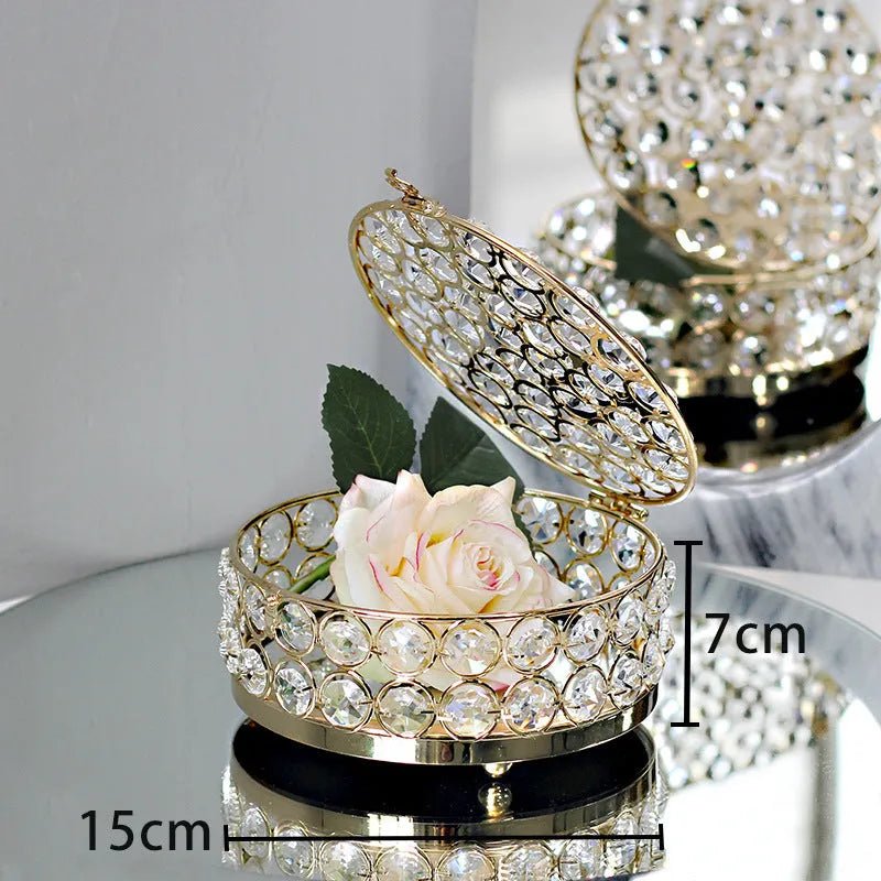 Transparent crystal glass jewellery storage box with French gold metal finish in a European style.