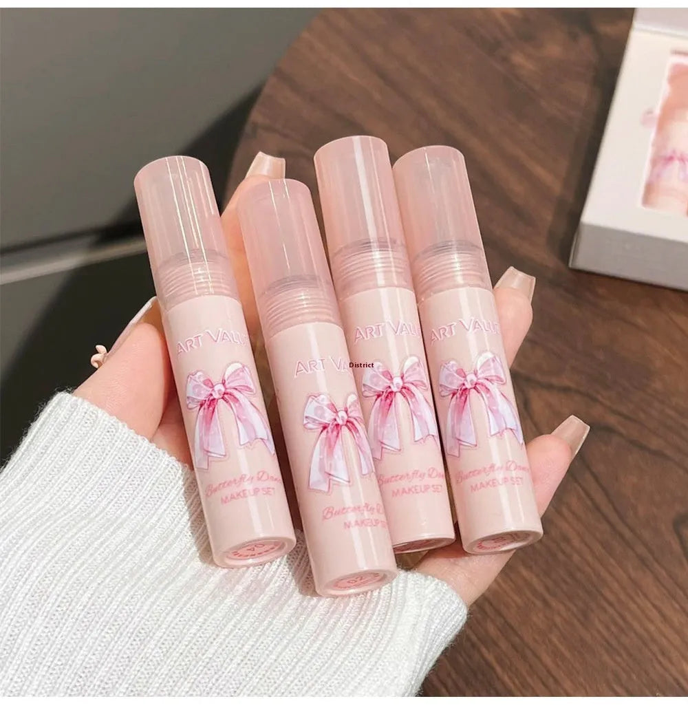 Butterfly Box makeup set with four pink lip mud pots, powder blusher, and necklace