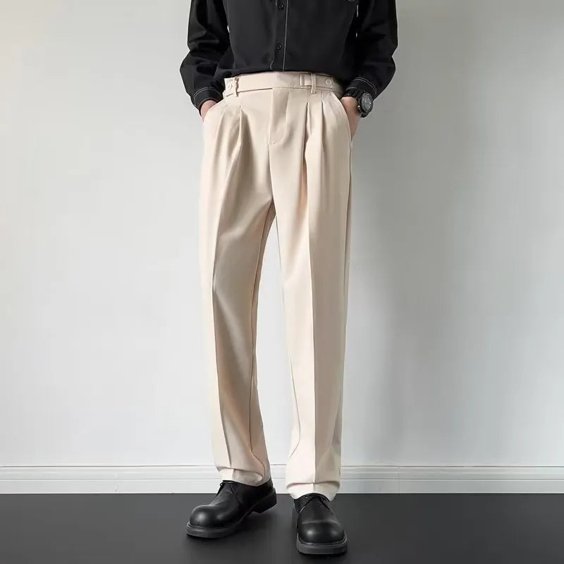 Men's apricot and black straight-leg loose fit suit trousers on a hanger