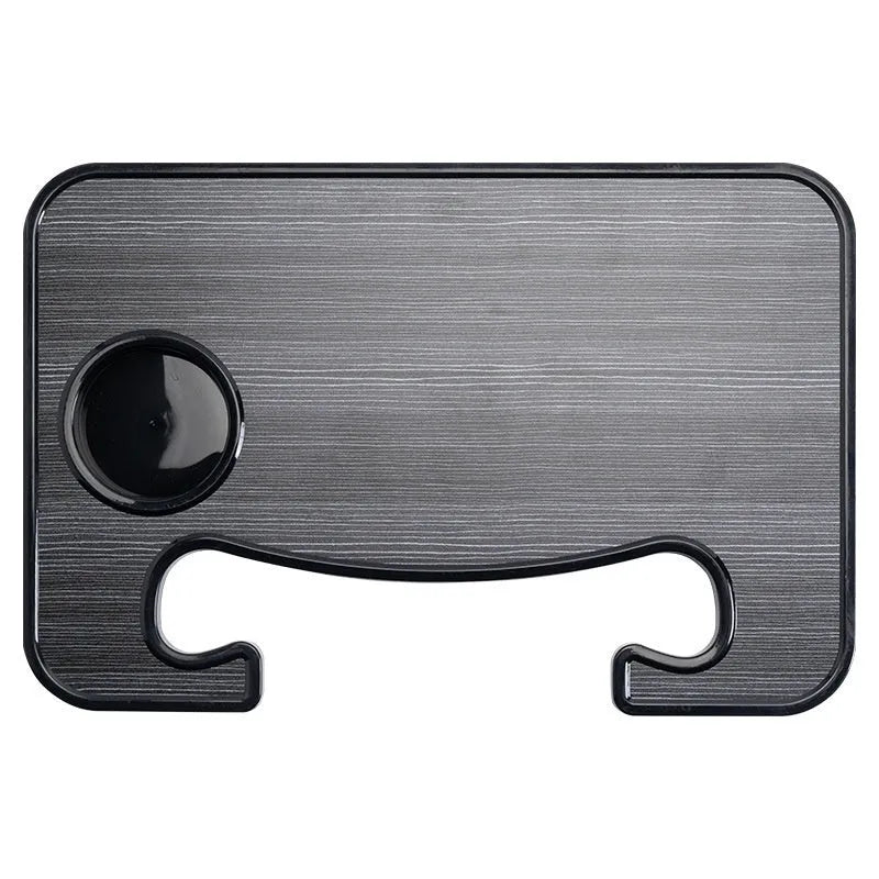Black foldable ABS plastic tray positioned on a car steering wheel, shown with a laptop and foldable cup holder.