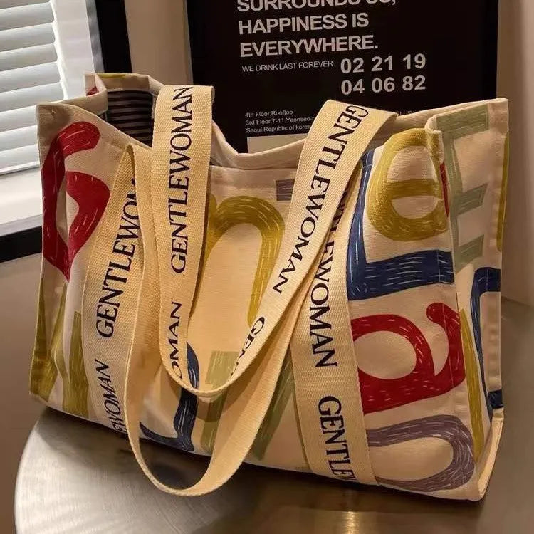 Large capacity cotton canvas tote bag with printed design options including black letter, coloured letter and pattern styles