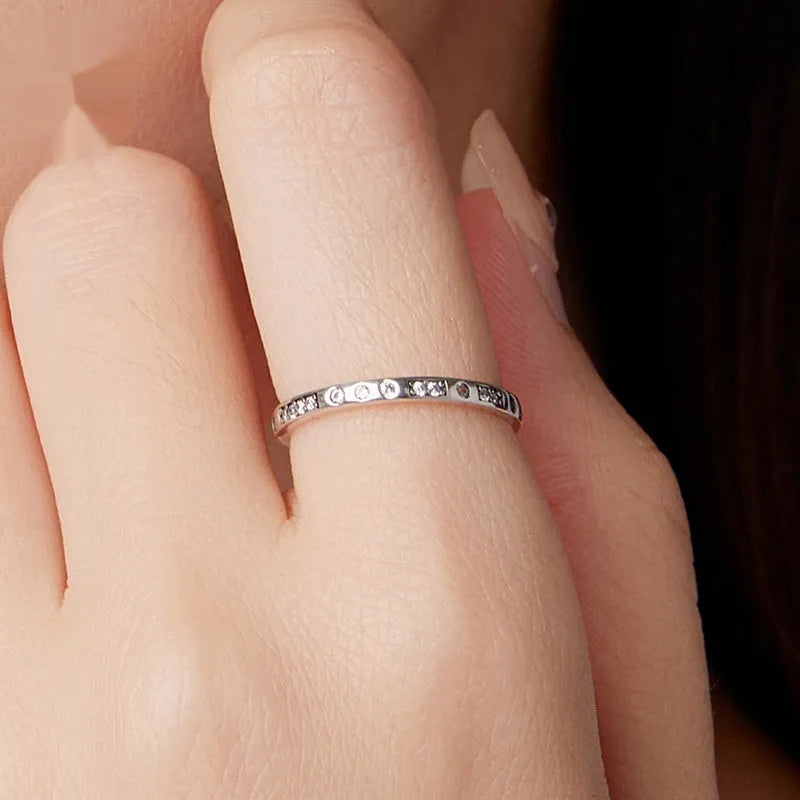 Sterling silver I Love You password ring with oxidised black finish showing engraved text