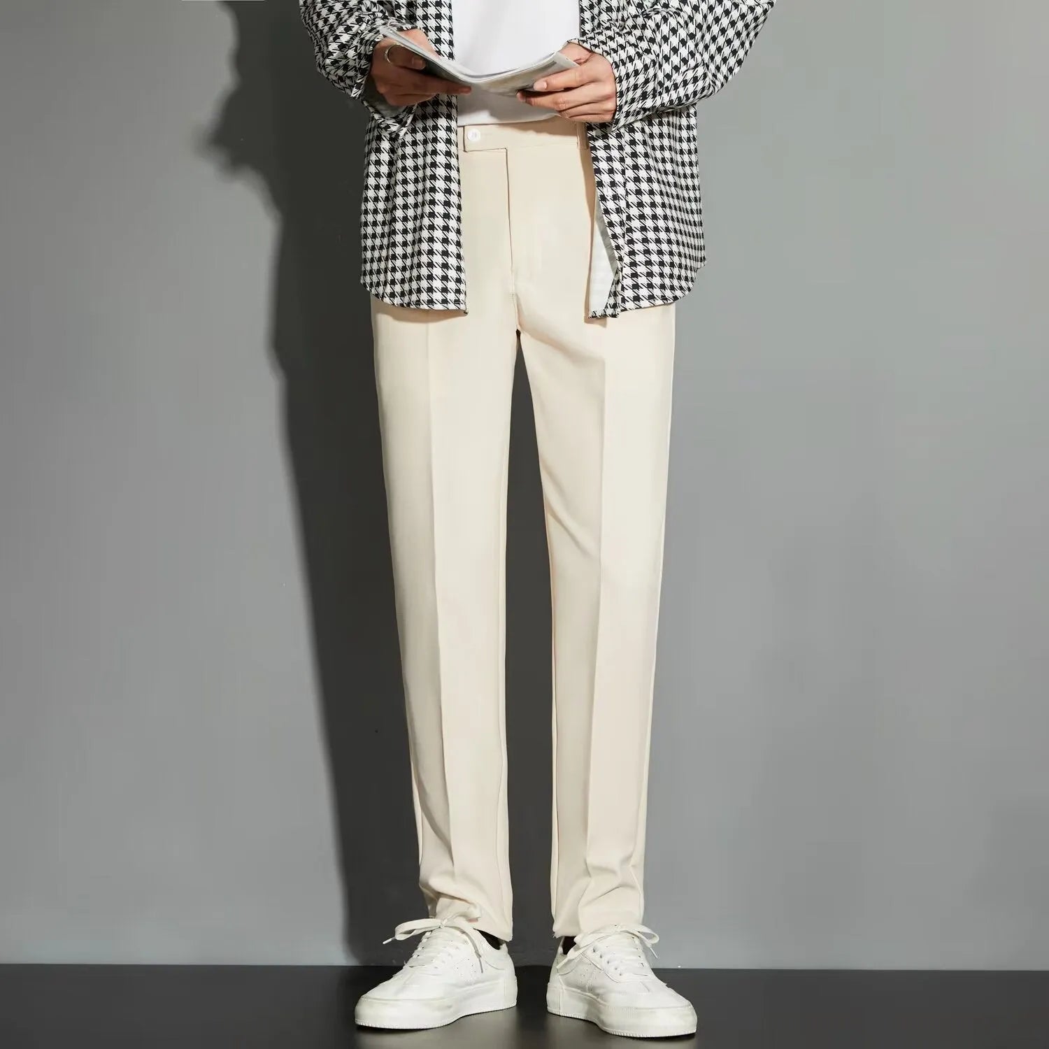Men's straight leg ankle-length suit trousers in apricot colour on a model