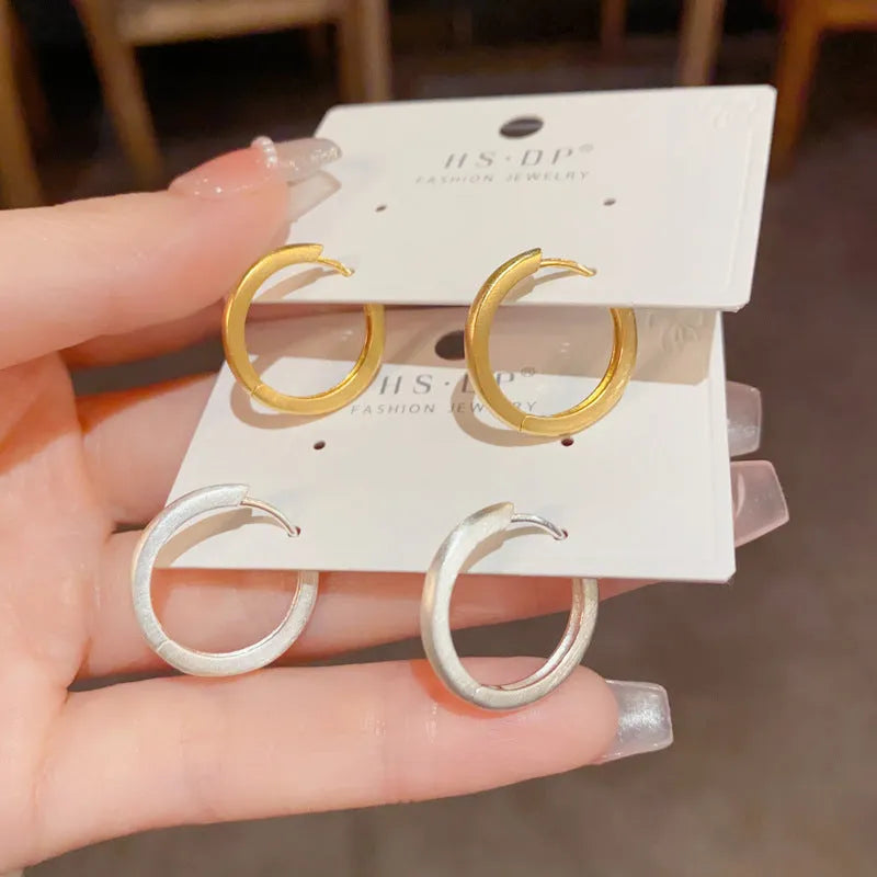Geometric round gold plated ear clip on copper base with clip fastening