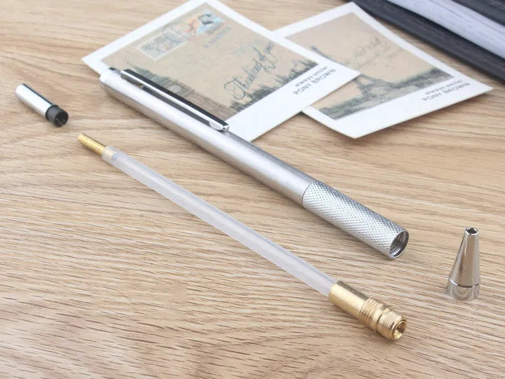 A metal mechanical pencil for drafting and writing with multiple lead size options.