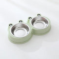 Frog-shaped plastic holder containing two stainless steel pet bowls for food and water.