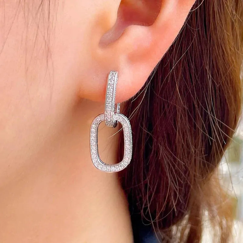 Pair of copper earrings with inlaid zircon, U-shaped geometric buckle design in white gold colour