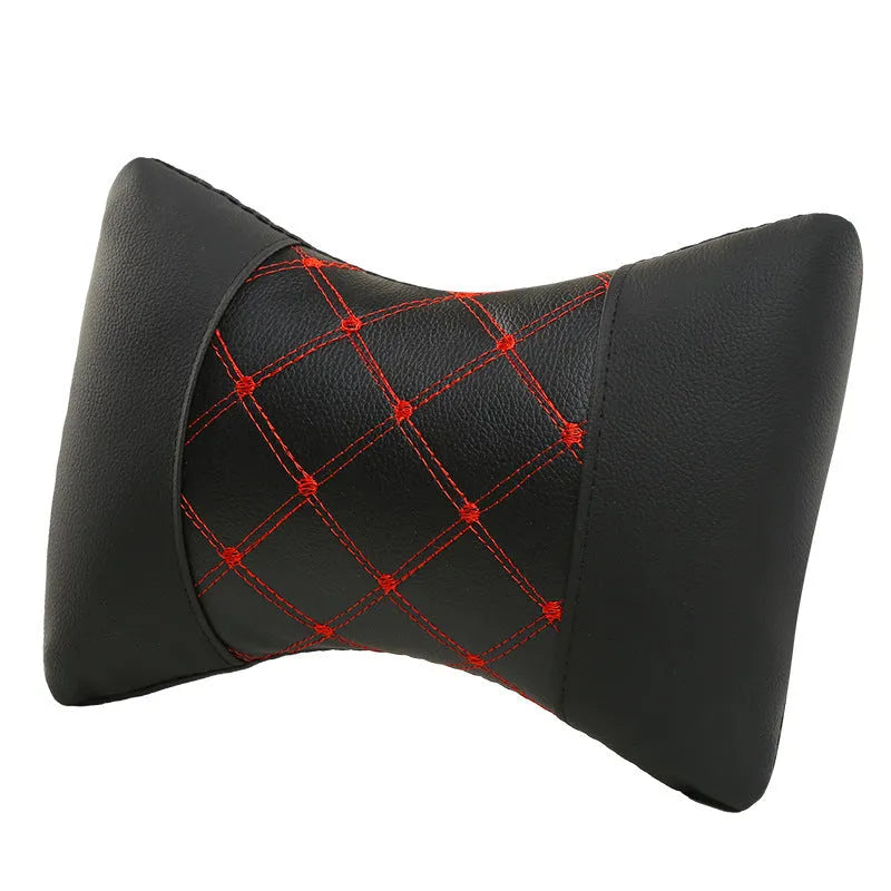 Black quilted diamond pattern car headrest pillow with coloured stitching for neck support.
