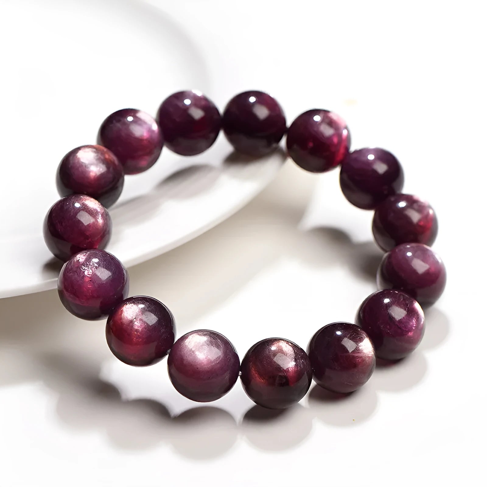 Purple lepidolite crystal bracelet with round polished beads, showing five different bead size options.