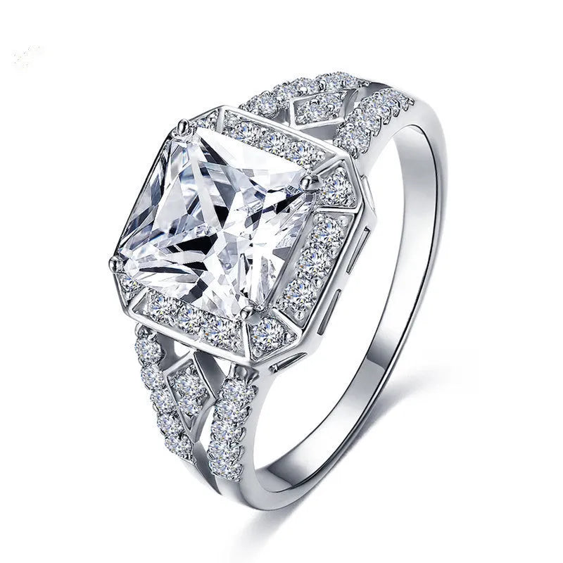 Women's geometric zircon ring with hollow design and platinum colour finish showing quadrilateral decorative elements