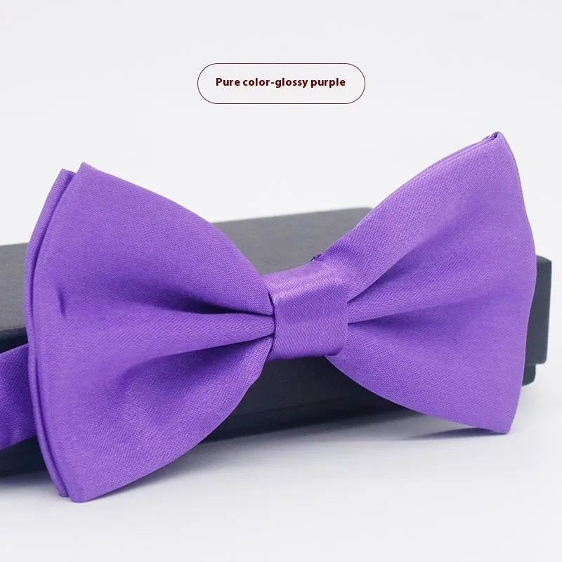 Solid colour flat head bow tie for formal wear in multiple colours including black, red, and blue.