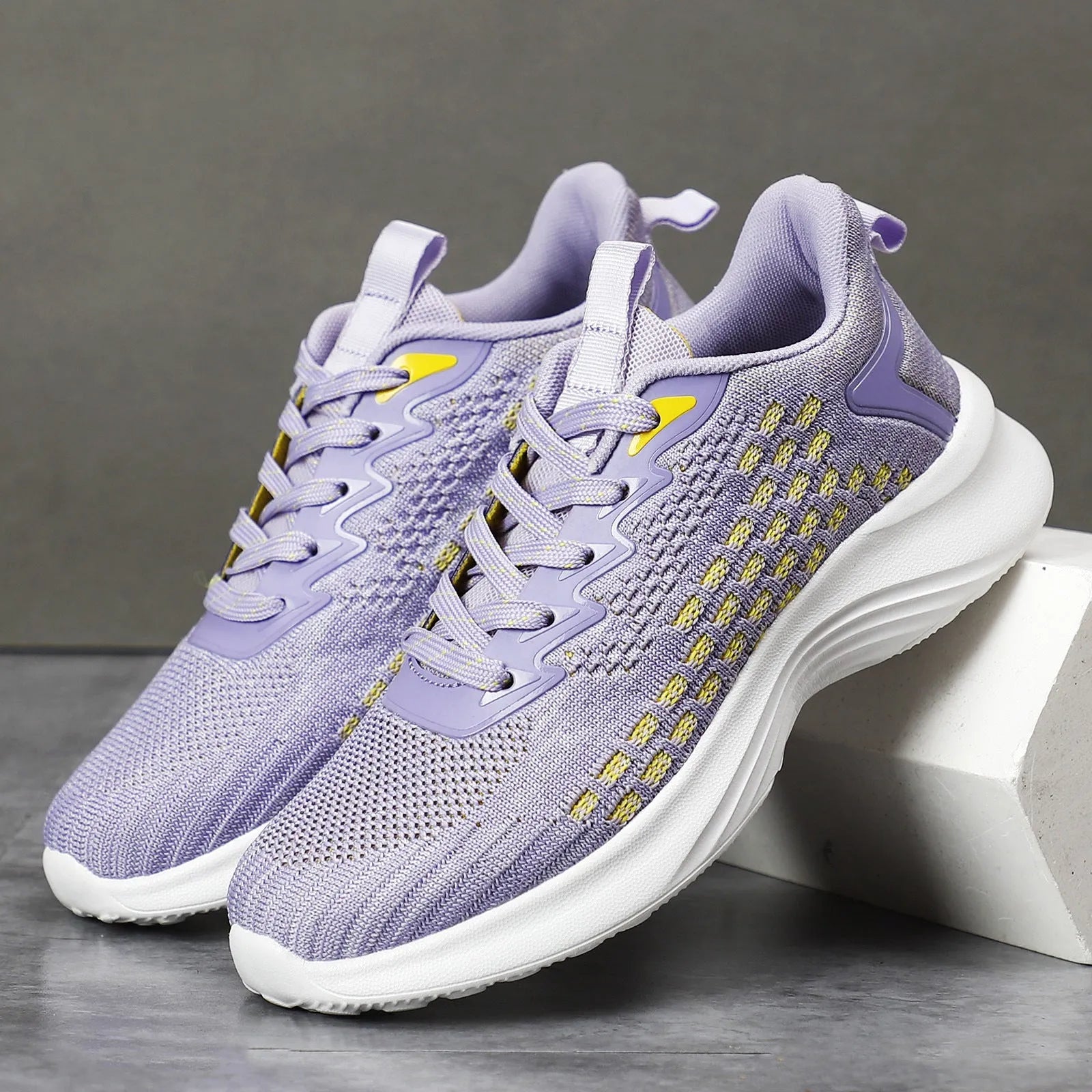 Women's lavender purple Flyknit running shoes with mesh upper and EVA sole for athletic use