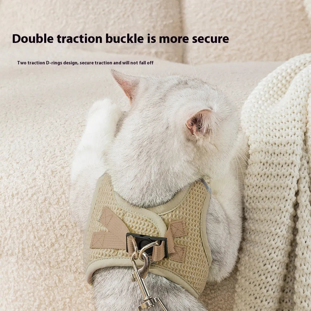 Brown waffle cloth cat harness with integrated pulling rope and chest strap laid flat.