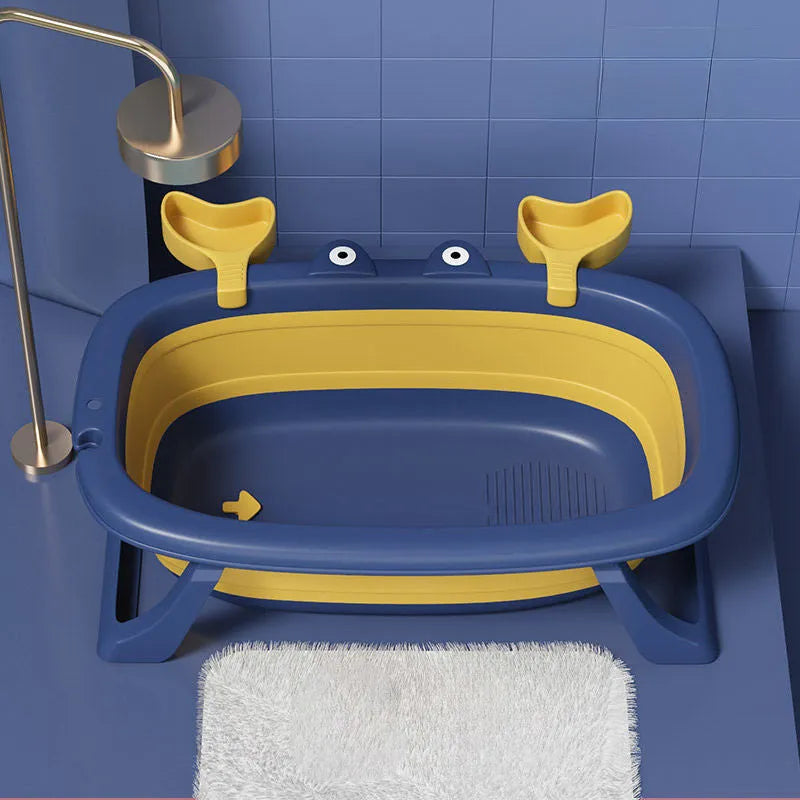 Blue foldable portable pet tub set up for washing a small dog, showing its collapsible metal frame.