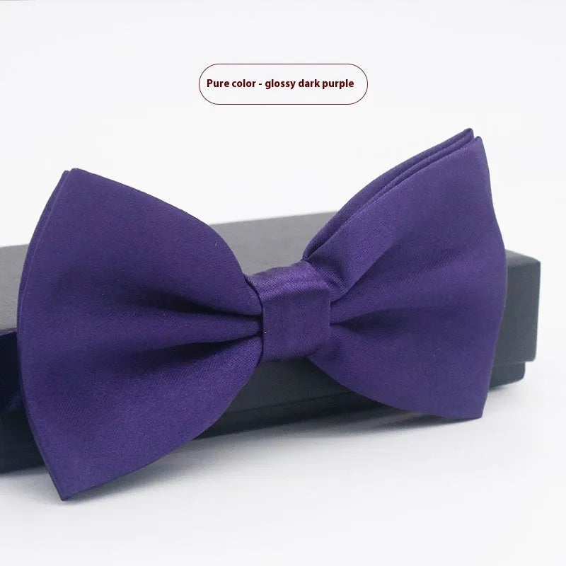 Solid colour flat head bow tie for formal wear in multiple colours including black, red, and blue.