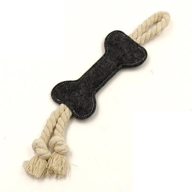 Bone-shaped dog chew toy with felt exterior showing rope knot texture inside, 16cm long in blue colour