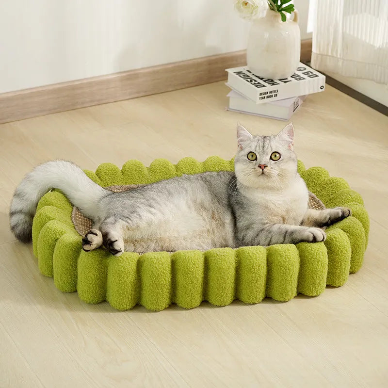 Green oval sisal cat scratching pad that also serves as a cat bed.