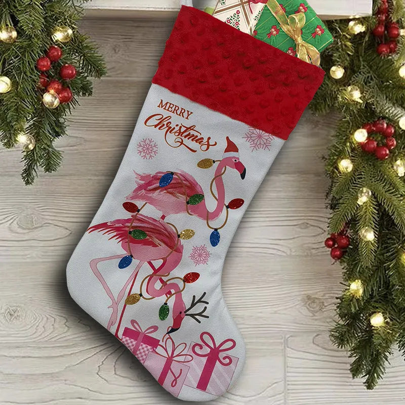 Red cloth flamingo Christmas stocking decoration with white trim, shown hanging.
