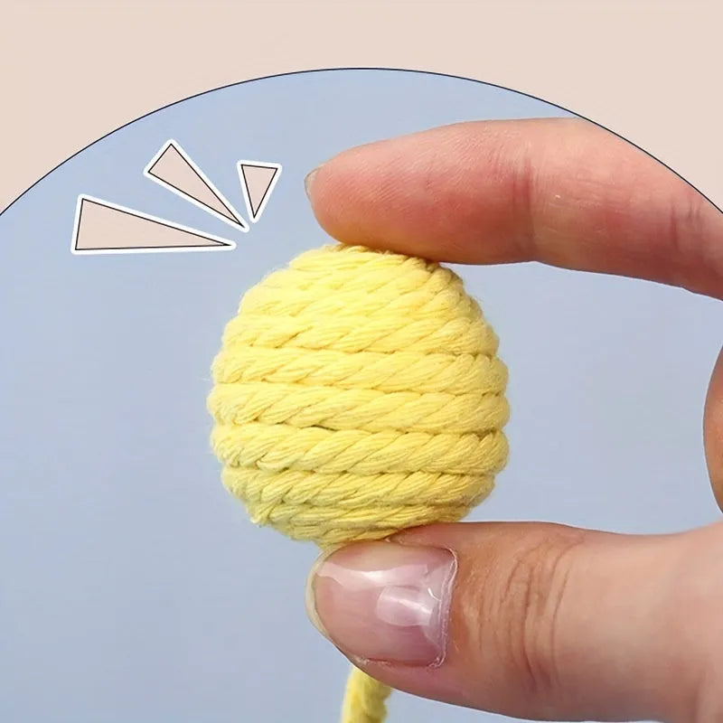 Cat toy ball with rope in four colours: green, pink, purple, and yellow