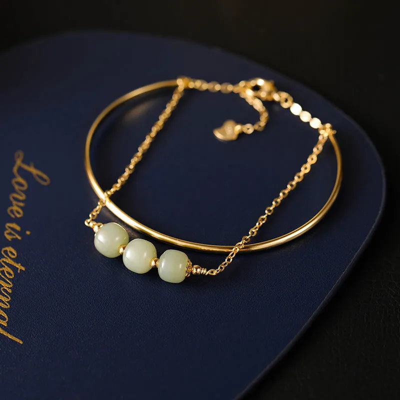 Women's Hetian jade lucky beads bracelet with gold inlay, shown in single, double, and three bead versions.