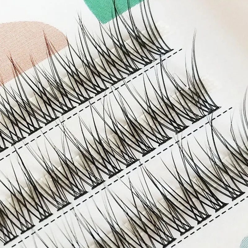 Black V-shaped Fairy Fishtail false eyelashes with thick segments on a clear tray, showing the 8mm to 12mm length options.