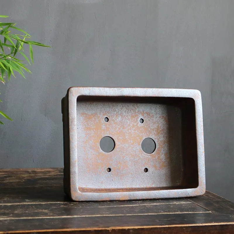 Purple sand rectangular bonsai basin shown in two sizes for floor-standing plant display.
