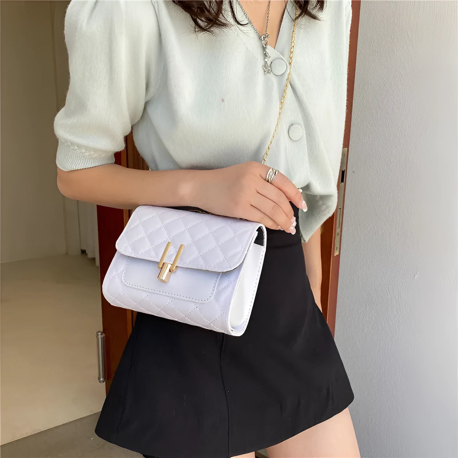 Women's crossbody bag with diamond lattice chain strap in black, white or green minimalist design