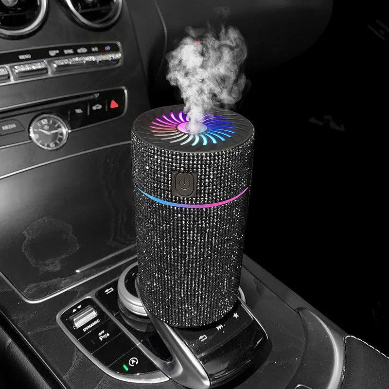 Compact white car air humidifier and purifier with USB cable on a car dashboard