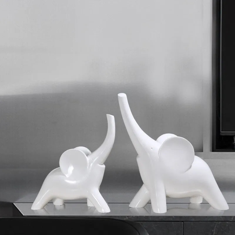 Modern resin elephant ornament in rose gold or white colour, available in large and small sizes.