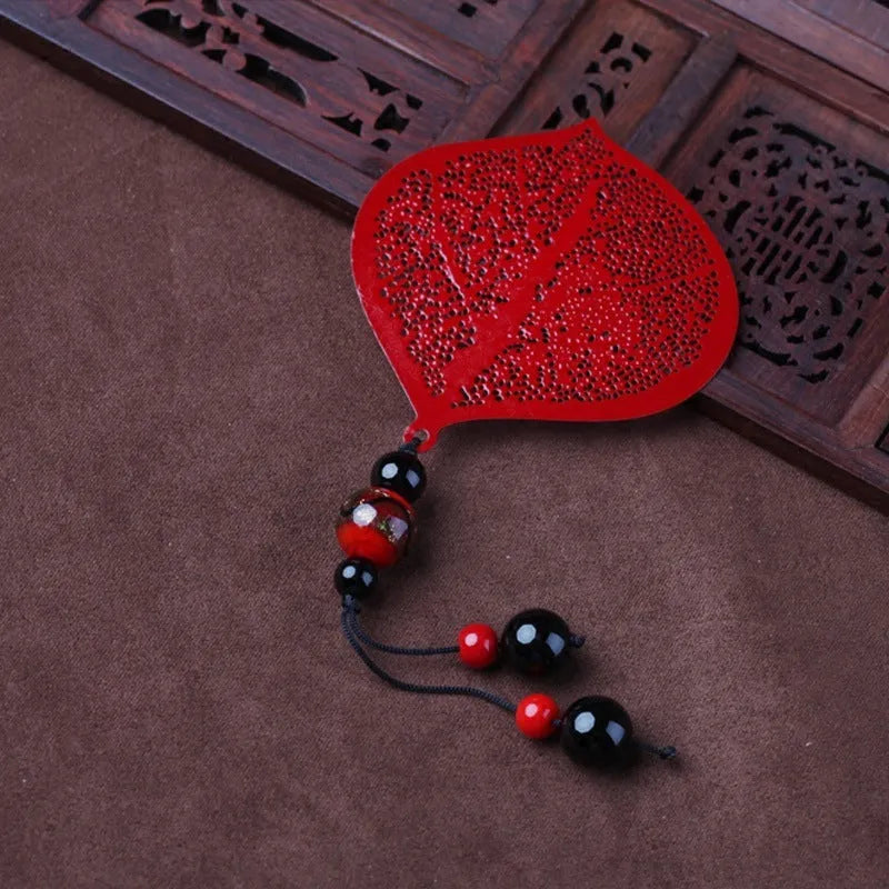 Brass bookmark with hollow-cut leaf design and matching rose gold metal tassel