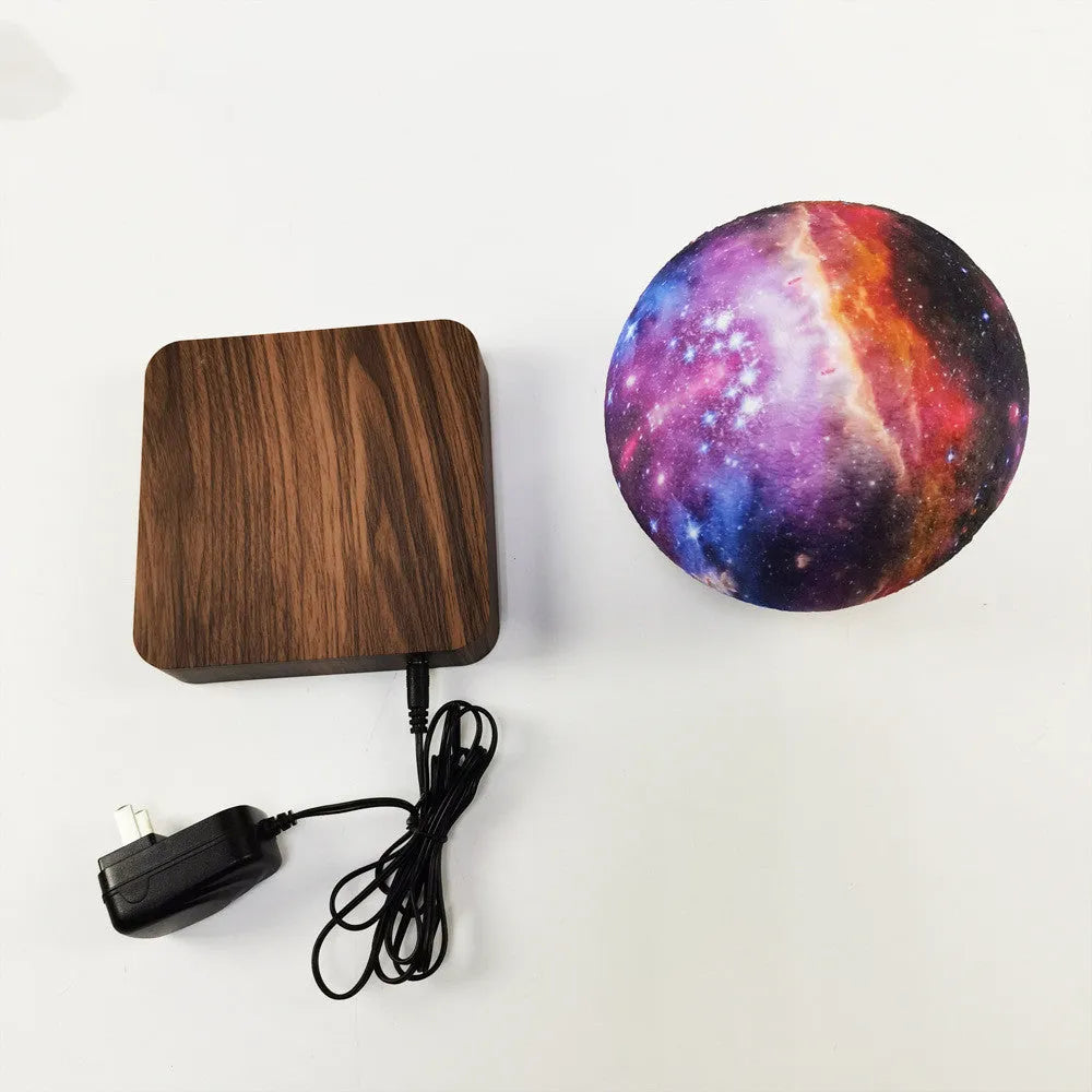 Square walnut magnetic levitation galaxy moon lamp floating above its circular base.