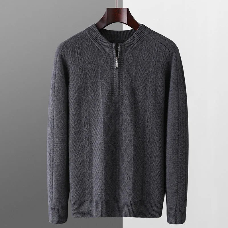 Men's grey wool half zip sweater with a diamond lattice pattern, shown on a model.