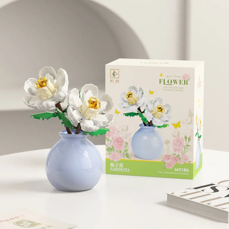 Assembled plastic building block flower in vase on tabletop
