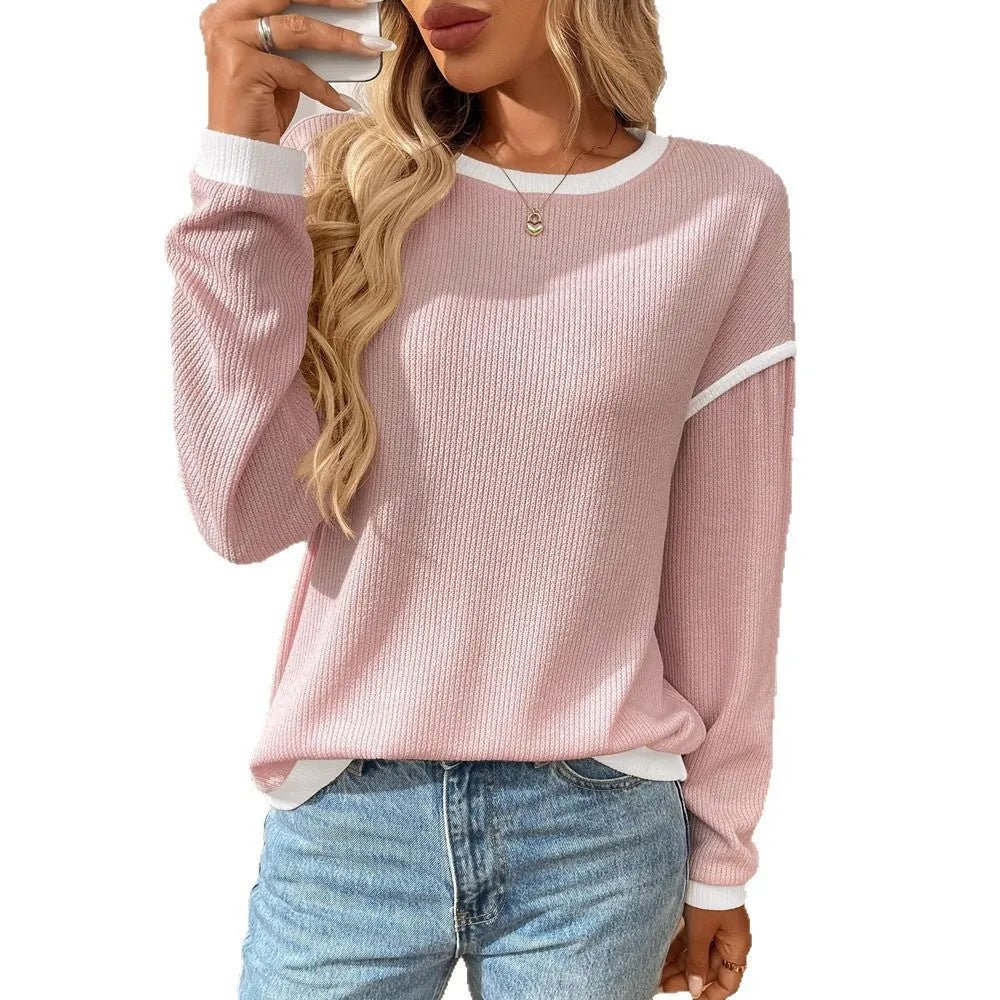 A woman's loose-fitting long sleeve polyester pullover top in a light aqua blue colour.